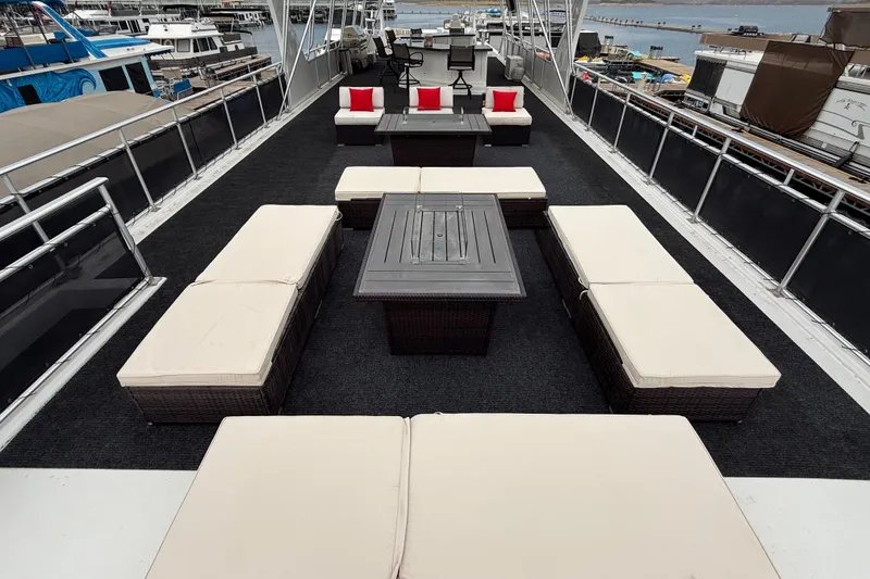 Slide: The Image of Luxurious 2008 Sumerset houseboat deck with elegant seating and scenic marina view. - 10