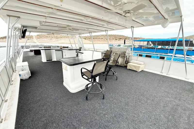 Slide: The Image of Spacious deck of 2008 Sumerset Luxury HouseBoat with seating and outdoor kitchen. - 16