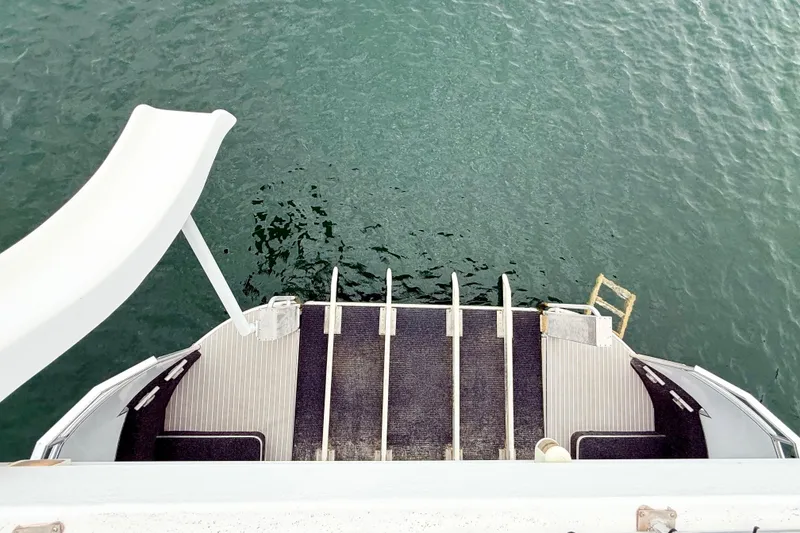 Slide: The Image of Luxury Sumerset houseboat with slide and swim platform, 2008 model, on calm water. - 19