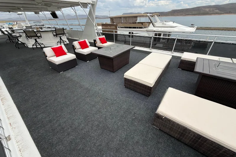 Slide: The Image of Luxurious 2008 Sumerset houseboat deck with stylish seating and scenic water views. - 21