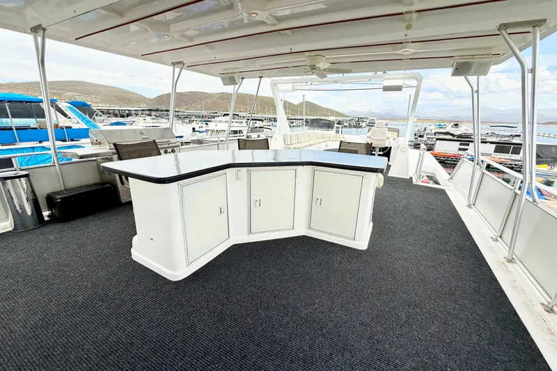 Slide: The Image of Luxurious 2008 Sumerset houseboat deck with bar, marina view, and modern amenities. - 28