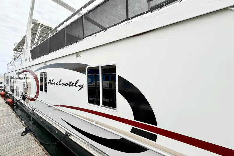 Slide: The Image of 2008 Sumerset Luxury HouseBoat 102' X 19' docked, featuring sleek design and modern amenities. - 3