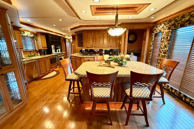 Slide: The Image of Luxurious kitchen interior of 2008 Sumerset HouseBoat, featuring elegant wood finishes and modern amenities. - 34