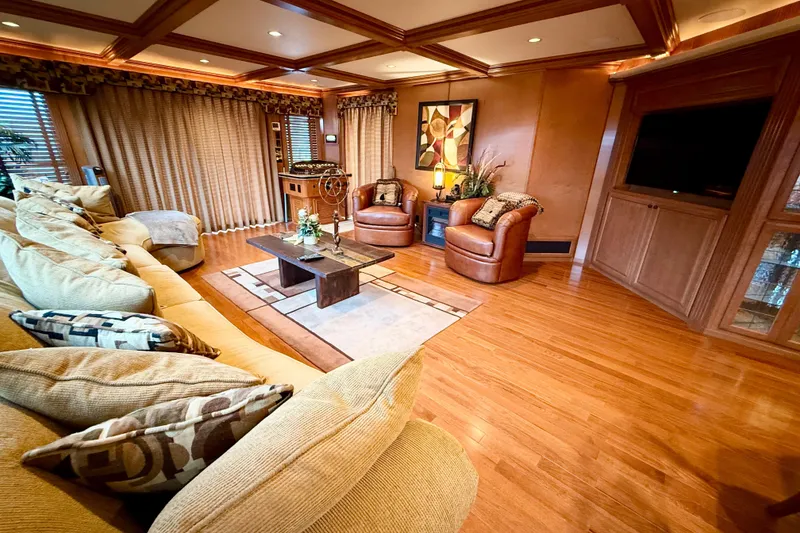 Slide: The Image of Luxurious 2008 Sumerset houseboat interior with elegant seating, wooden flooring, and stylish decor. - 36