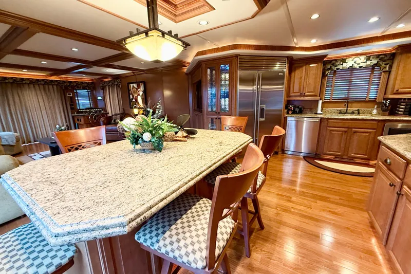 Slide: The Image of Luxurious 2008 Sumerset houseboat kitchen with granite countertops and elegant wooden cabinetry. - 37