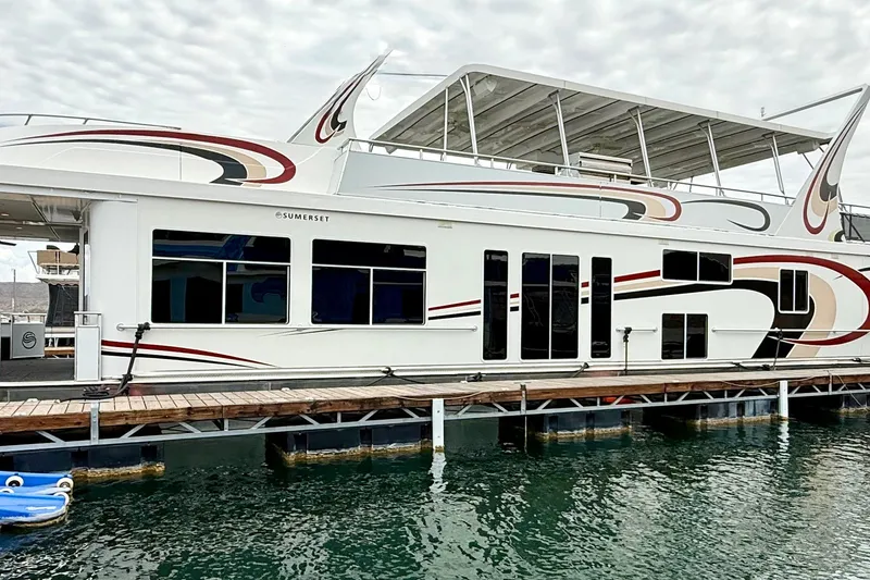 Slide: The Image of 2008 Sumerset Luxury HouseBoat 102' X 19' docked on calm water. - 4