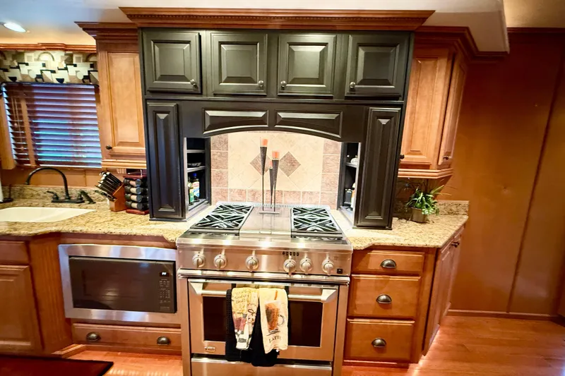 Slide: The Image of Luxurious kitchen in 2008 Sumerset houseboat with modern appliances and elegant cabinetry. - 40