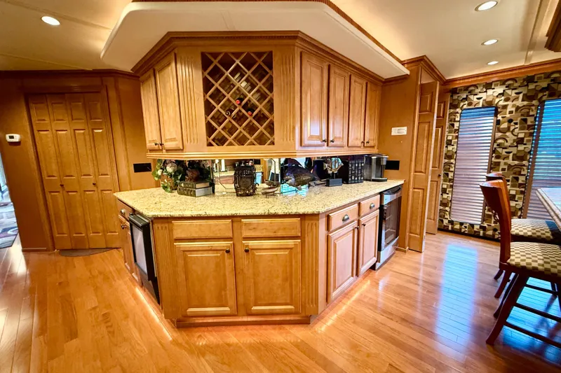 Slide: The Image of Luxurious kitchen interior of 2008 Sumerset HouseBoat with wooden cabinetry and modern appliances. - 41