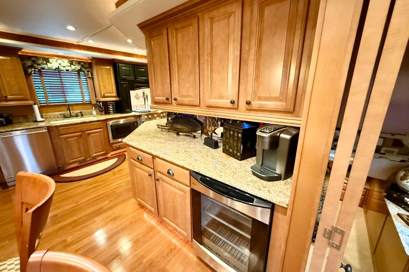 Slide: The Image of Luxurious kitchen interior of 2008 Sumerset Houseboat with wooden cabinets and modern appliances. - 44