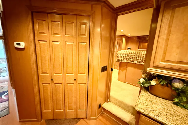 Slide: The Image of Luxurious 2008 Sumerset houseboat interior with wooden cabinetry and cozy bedroom. - 45