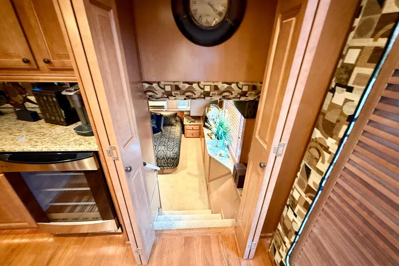 Slide: The Image of Interior view of 2008 Sumerset Luxury HouseBoat, featuring elegant wood finishes and modern decor. - 47