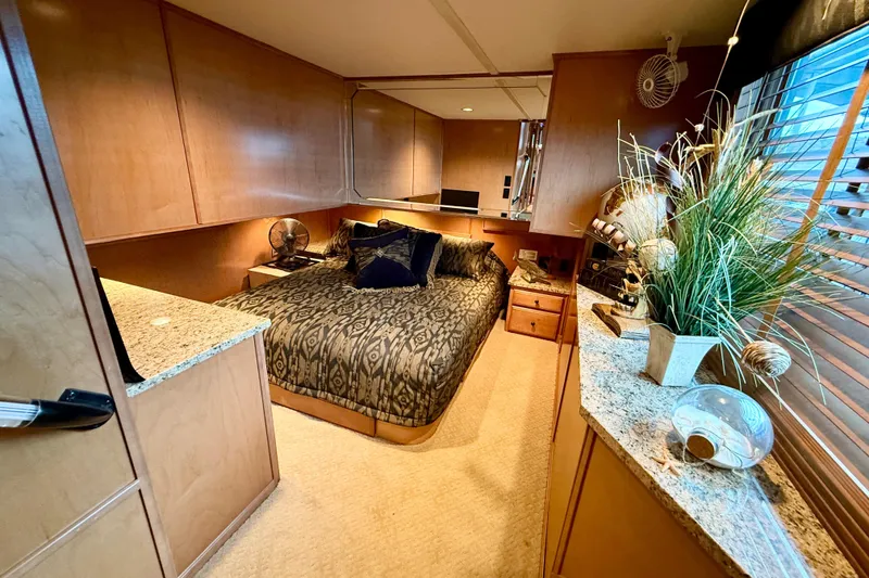 Slide: The Image of Luxurious bedroom interior of 2008 Sumerset HouseBoat, featuring elegant decor and natural light. - 48