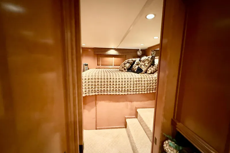 Slide: The Image of Luxurious bedroom interior of 2008 Sumerset HouseBoat, featuring elegant bedding and cozy lighting. - 49