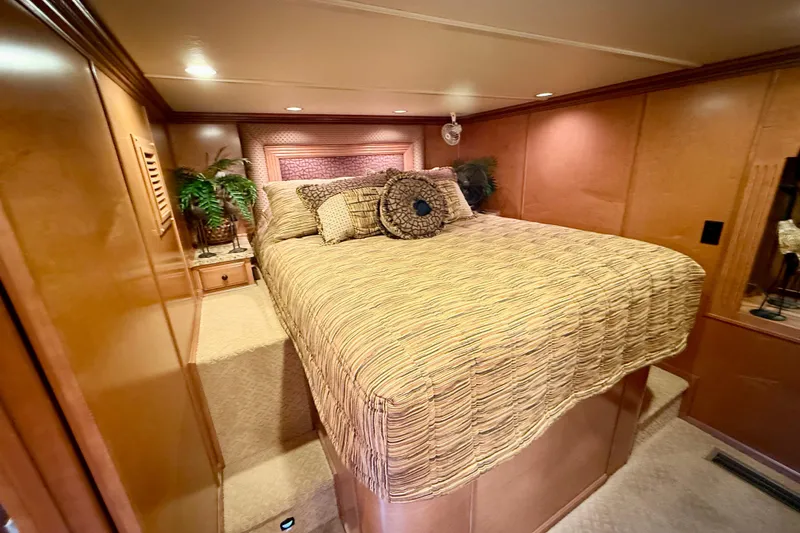 Slide: The Image of Luxurious bedroom interior of 2008 Sumerset HouseBoat, featuring elegant bedding and warm wood accents. - 54