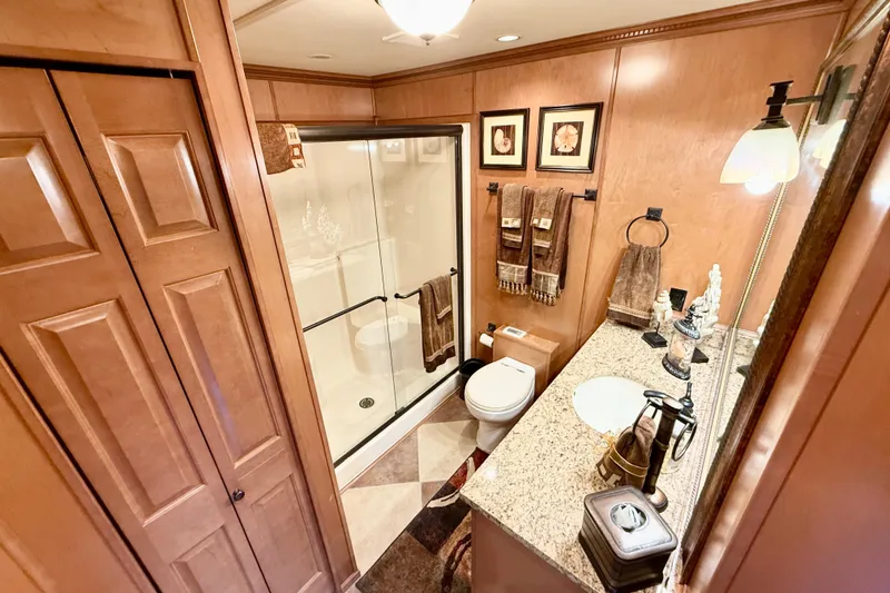 Slide: The Image of Luxurious bathroom in 2008 Sumerset HouseBoat, featuring elegant wood finishes and modern amenities. - 55