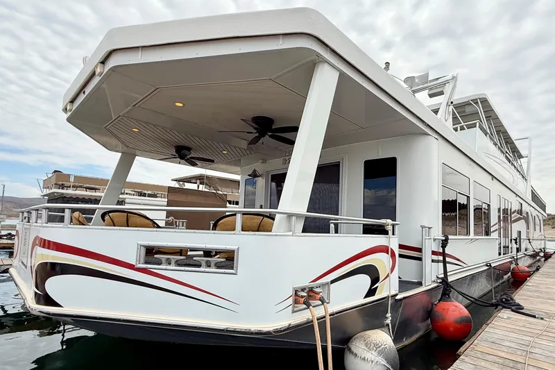 Slide: The Image of Luxury 2008 Sumerset Houseboat, 102' x 19', docked with stylish exterior design. - 6