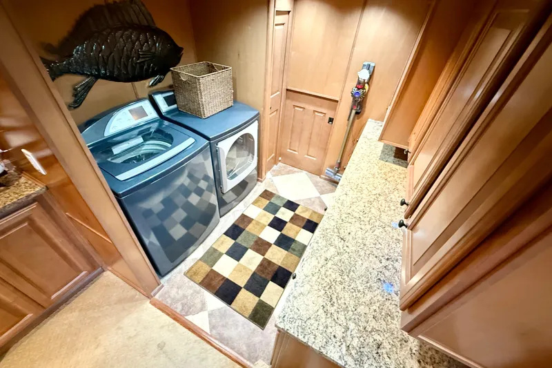Slide: The Image of Laundry room in 2008 Sumerset Luxury HouseBoat with washer, dryer, and granite countertop. - 61
