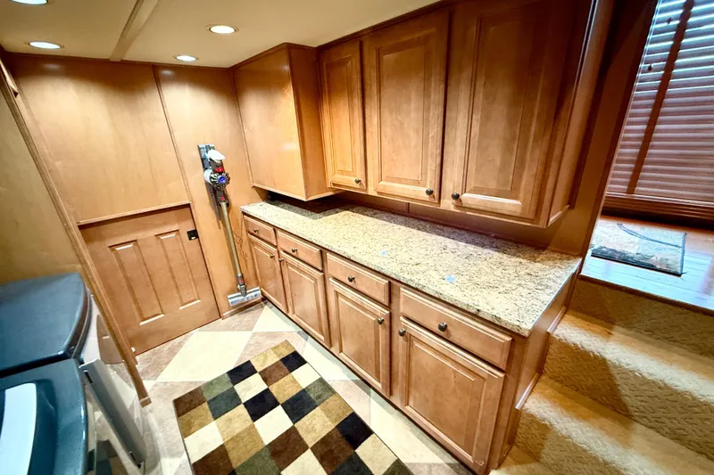 Slide: The Image of Luxurious 2008 Sumerset houseboat kitchen with wooden cabinets and granite countertops. - 65