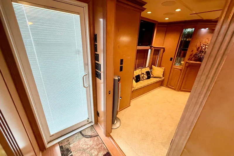 Slide: The Image of Interior of 2008 Sumerset Luxury HouseBoat, featuring cozy seating and elegant wood paneling. - 67