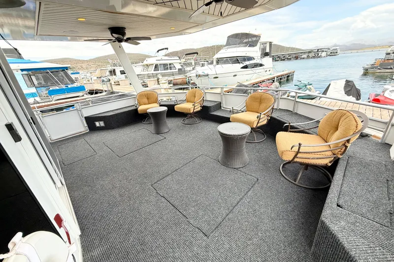 Slide: The Image of Spacious deck of 2008 Sumerset Luxury HouseBoat with comfortable seating and scenic marina view. - 7