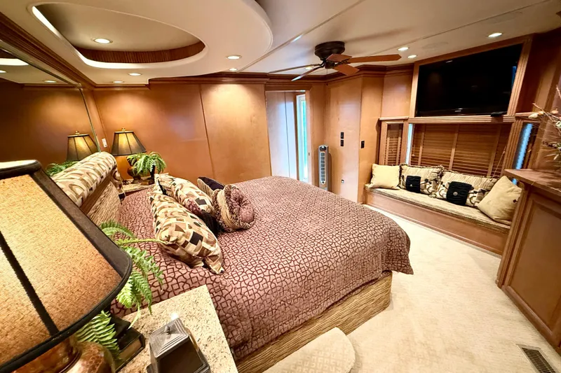 Slide: The Image of Luxurious bedroom interior of 2008 Sumerset HouseBoat, featuring elegant decor and cozy seating area. - 72