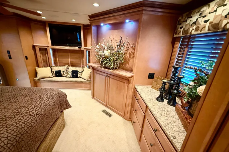 Slide: The Image of Luxurious 2008 Sumerset houseboat interior with elegant wood cabinetry and cozy seating area. - 73