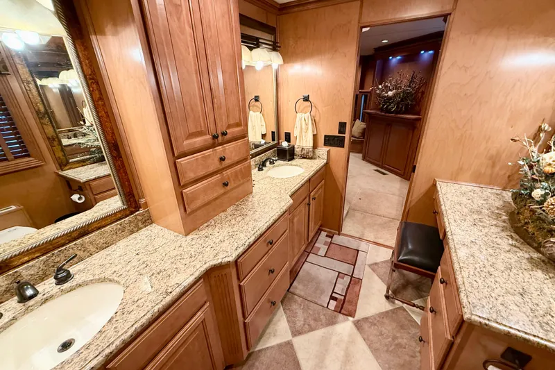 Slide: The Image of Luxurious bathroom interior on 2008 Sumerset HouseBoat with granite countertops and wooden cabinetry. - 77
