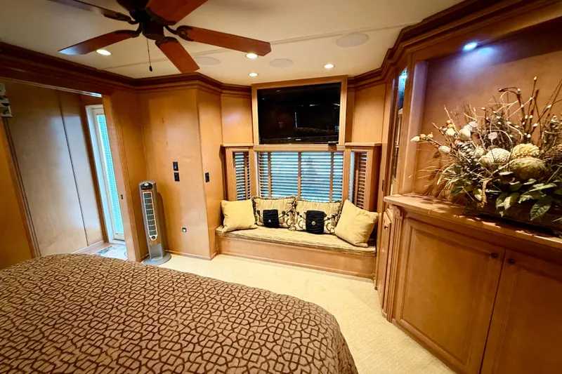 Slide: The Image of Luxurious 2008 Sumerset houseboat interior with elegant wood paneling and cozy seating area. - 79