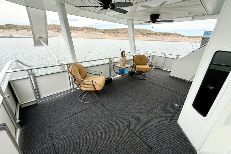 Slide: The Image of Spacious deck of 2008 Sumerset Luxury HouseBoat with seating, overlooking serene water. - 80