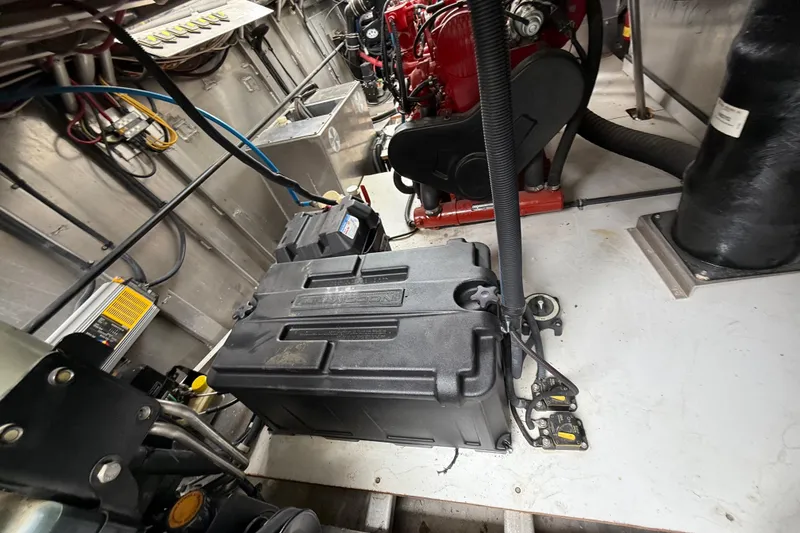 Slide: The Image of Engine room of a 2008 Sumerset Luxury HouseBoat, showcasing battery and wiring systems. - 88