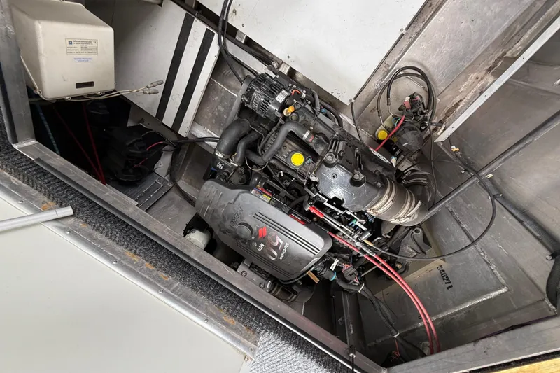 Slide: The Image of Engine compartment of a 2008 Sumerset Luxury HouseBoat, showcasing mechanical components and wiring. - 91