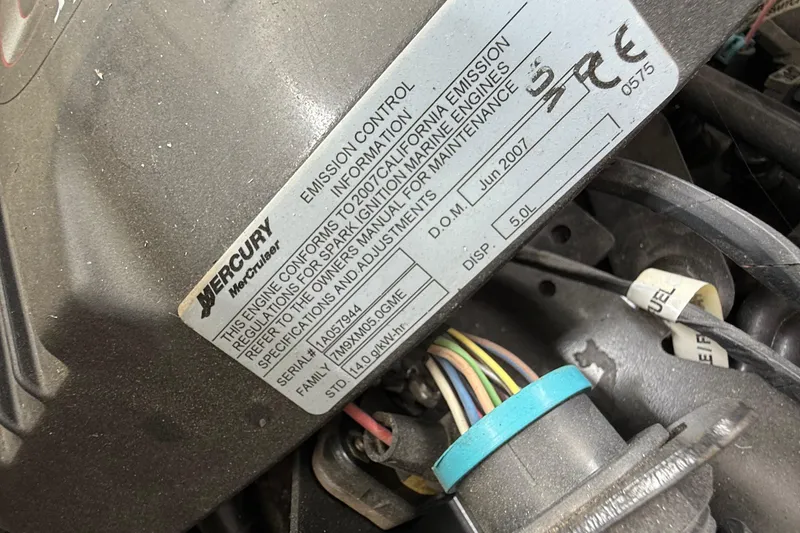 Slide: The Image of Mercury MerCruiser engine label on 2008 Sumerset Luxury HouseBoat, showing emission control details. - 93