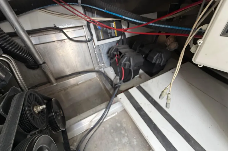 Slide: The Image of Engine compartment of a 2008 Sumerset Luxury HouseBoat, showing wiring and mechanical components. - 94