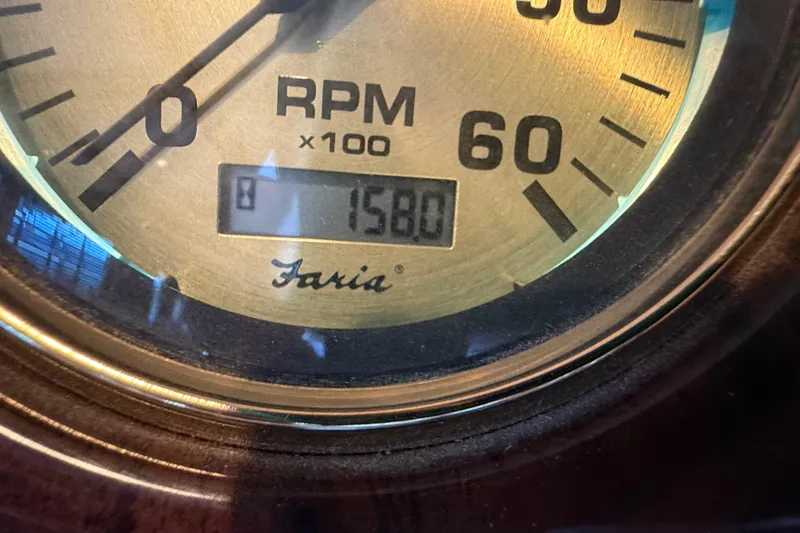 Slide: The Image of Close-up of a Faria RPM gauge reading 1580 on a 2008 Sumerset Luxury HouseBoat. - 98
