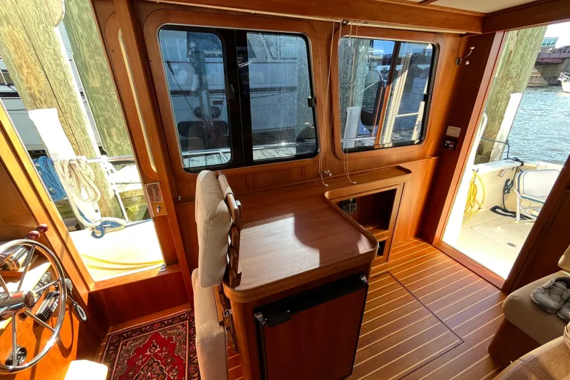 Slide: The Image of Interior of 2006 Sabre 36 Flybridge Sedan with wooden finish and nautical decor. - 22
