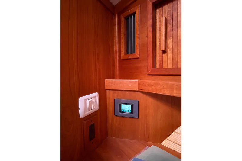 Slide: The Image of Interior of 2006 Sabre 36 Flybridge Sedan with wooden paneling and control panel. - 33