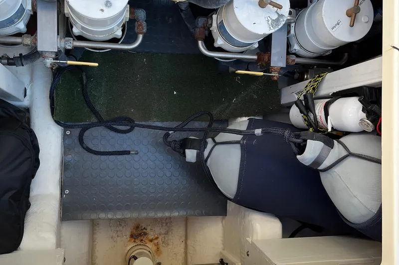 Slide: The Image of Engine compartment of a 2006 Sabre 36 Flybridge Sedan with visible components and equipment. - 43