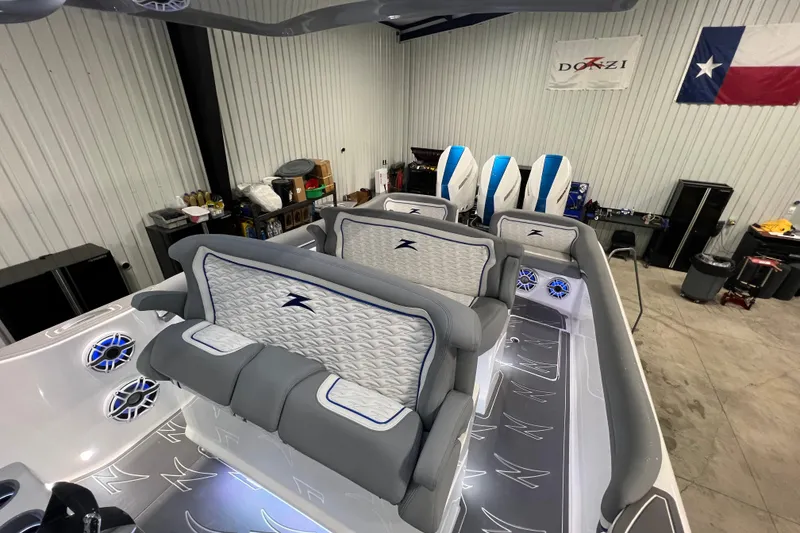 Slide: The Image of 2024 Donzi 39 VRZ boat dashboard with advanced controls and touchscreen displays. - 10