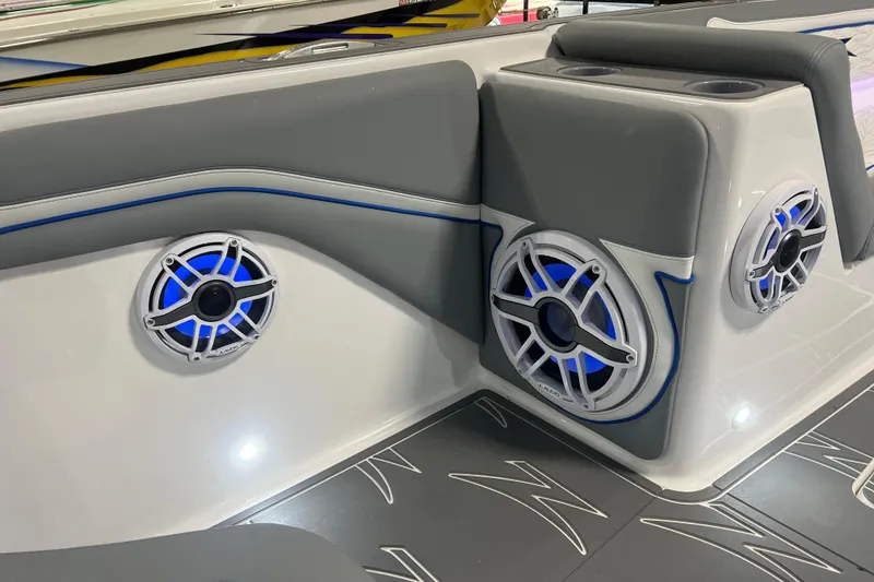 Slide: The Image of 2024 Donzi 39 VRZ boat interior with luxury seating and modern design in a garage setting. - 11