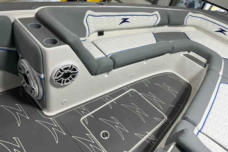 Slide: The Image of 2024 Donzi 39 VRZ boat interior with blue-lit speakers and stylish seating. - 15