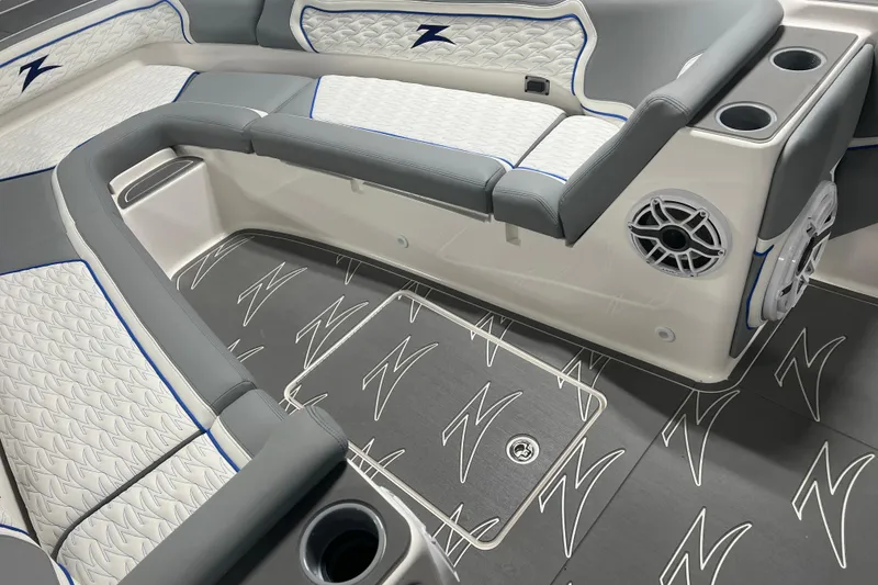 Slide: The Image of 2024 Donzi 39 VRZ boat interior with gray seating and speaker system. - 16