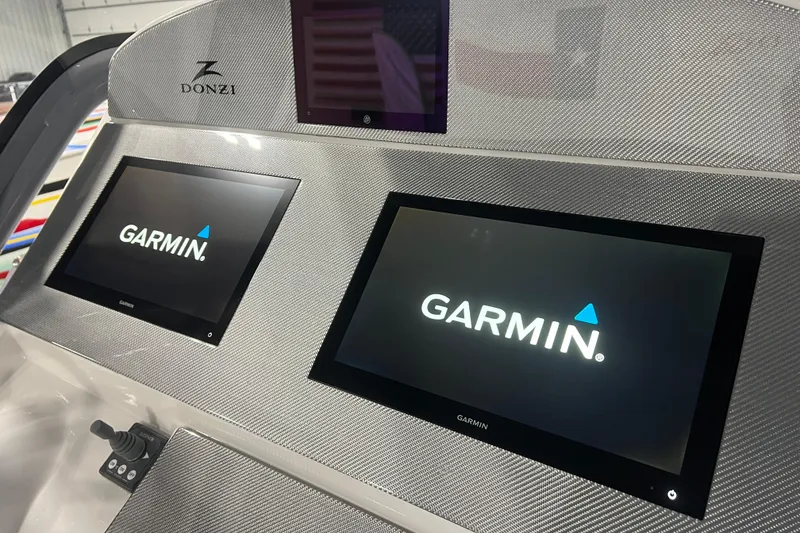 Slide: The Image of 2024 Donzi 39 VRZ boat interior with JL Audio speakers and stylish seating. - 20