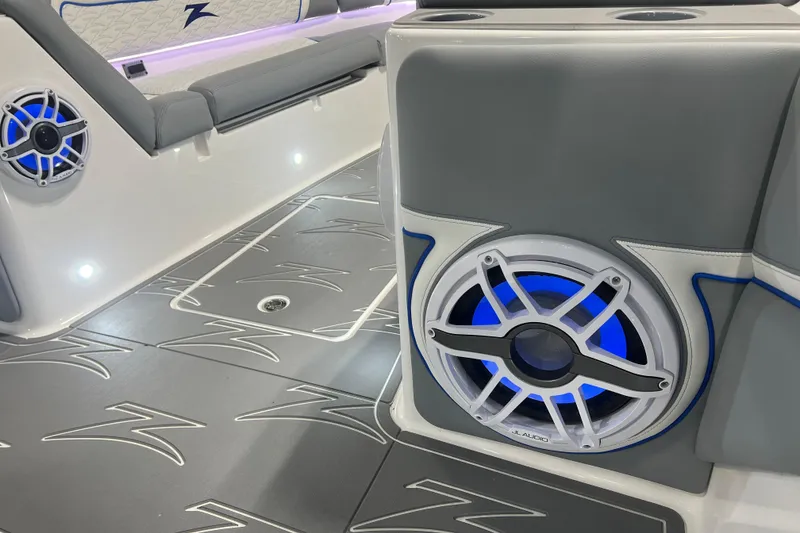 Slide: The Image of 2024 Donzi 39 VRZ boat interior with sleek seating, LED lighting, and modern speaker system. - 22