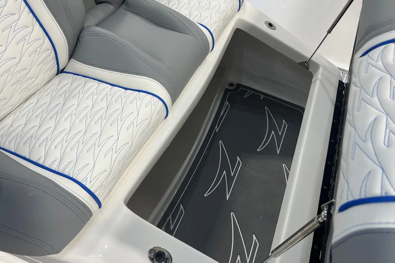 Slide: The Image of 2024 Donzi 39 VRZ interior with stylish seating and illuminated JL Audio speakers. - 23