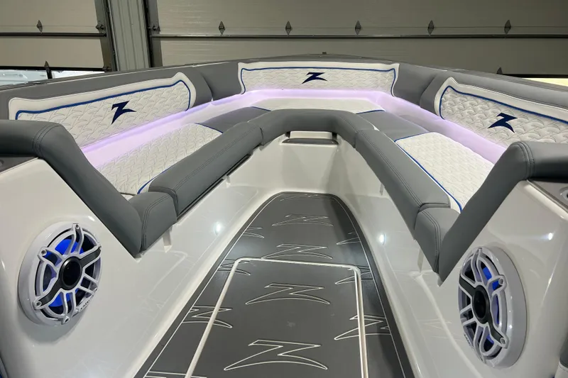 Slide: The Image of 2024 Donzi 39 VRZ boat interior with stylish seating and storage compartment. - 24