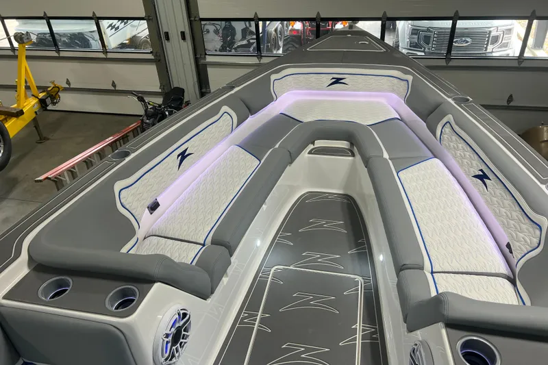 Slide: The Image of 2024 Donzi 39 VRZ boat interior with stylish seating and illuminated speakers. - 25
