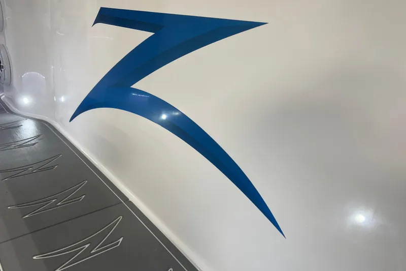 Slide: The Image of 2024 Donzi 39 VRZ interior with sleek design, blue accents, and integrated speaker system. - 27