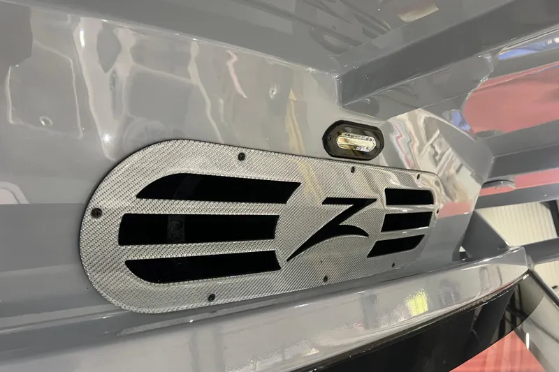 Slide: The Image of 2024 Donzi 39 VRZ boat interior with stylish gray and white seating, featuring blue accents. - 30