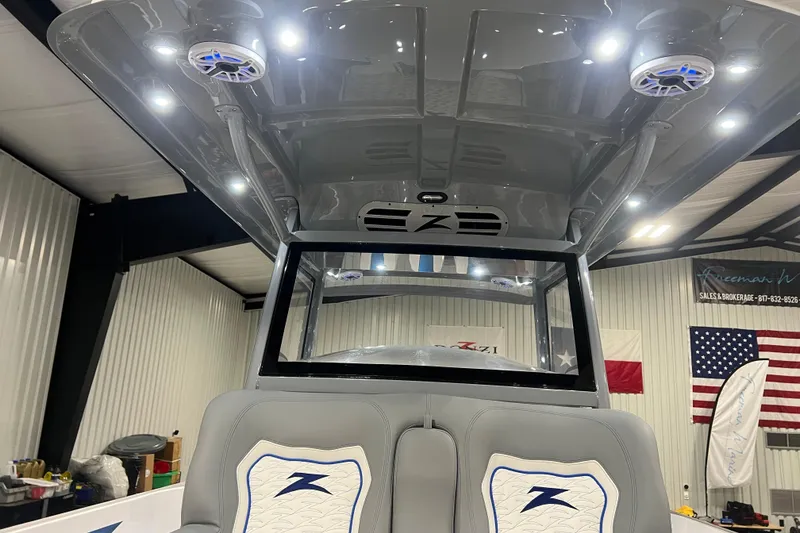 Slide: The Image of 2024 Donzi 39 VRZ boat detail with sleek design and modern emblem. - 31