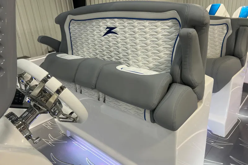 Slide: The Image of 2024 Donzi 39 VRZ boat interior with sleek seating and illuminated speakers. - 35